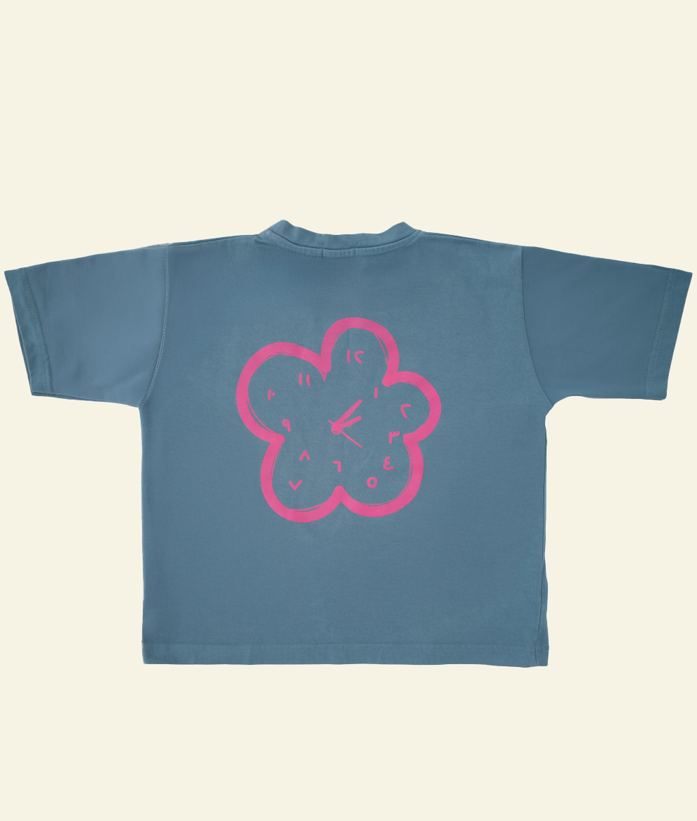 Back of the Oupah Clockwork Tee with pink flower-shaped clock outline