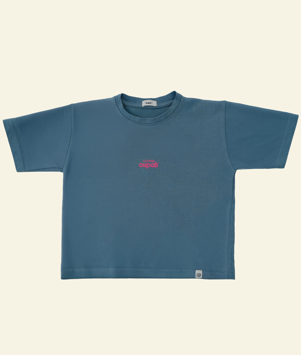 Front of the slate blue Oupah Clockwork Tee with small pink print