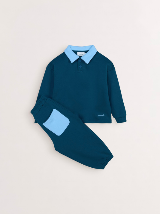 Avaacha Leo Tracksuit in Teal Pop: teal top with light blue collar and balloon-fit pants with blue pocket