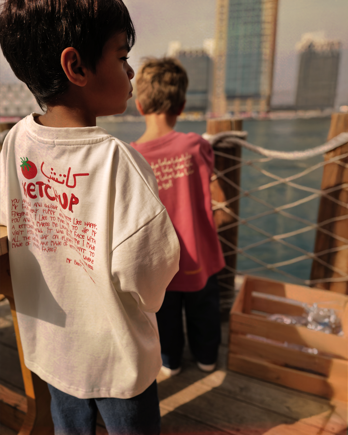 Kids wearing the Oupah Ketchup Tee outdoors