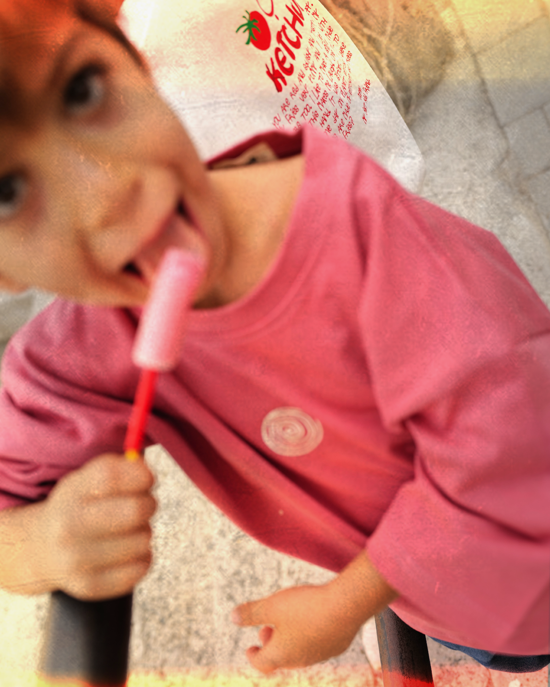 Child wearing the oversized pink Oupah Mama Tee outdoors